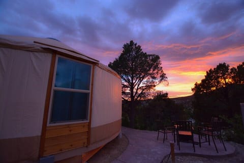 Yurt 9 sits right next to Yurt 10 on the second level of our hillside.  It has beautiful views of the sunset in the evening and has a private, outdoor seating area with a gas firepit and BBQ.  