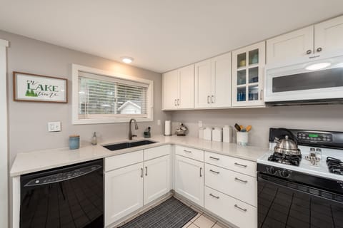 Well equipped kitchen with dishwasher and gas stove