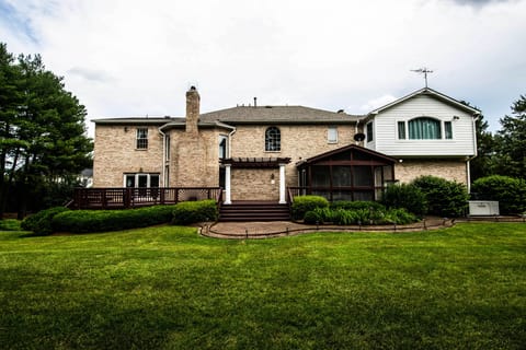 Spacious Deck w/ Covered Patio connects to garage & interior entertainment room