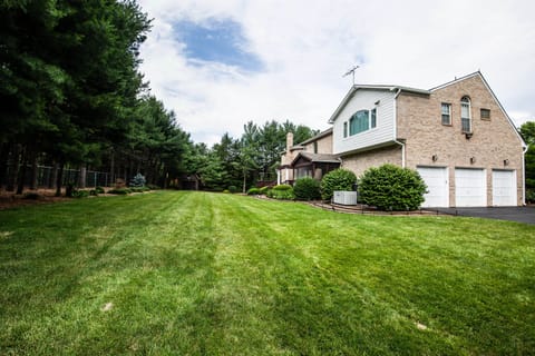 Spacious backyard with 3 car garage and home generator
