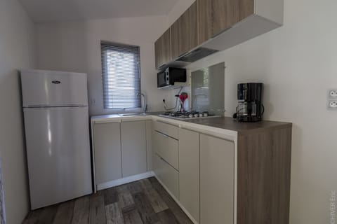 Mobile Home, 2 Bedrooms (Bahia Duo) | Private kitchen | Full-size fridge, microwave, stovetop, cookware/dishes/utensils