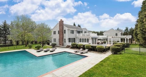 Escape to an extraordinary compound. Huge 4600 sq ft main house + private connecting guest house. Heated gunite pool w/ safety gates  for little ones. Great outdoor patios + decks, all surrounded by 40 ft hedges, making this your private sanctuary.