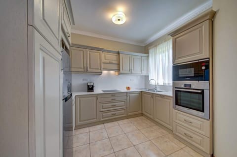 Our cozy kitchen is equipped with stainless steel appliances, an espresso machine, a toaster, and other essentials.