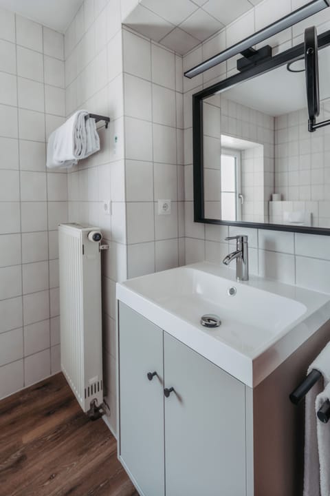 Shower, hair dryer, towels, toilet paper