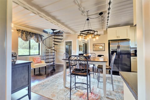 Open spacious kitchen floor plan. You can see the classy metal container ceiling