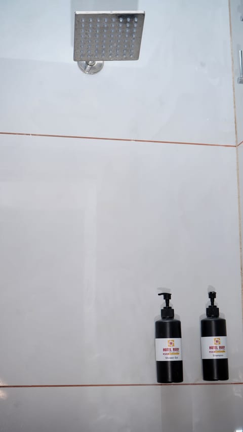 Four bed Royal Deluxe | Bathroom | Shower, free toiletries, towels, soap