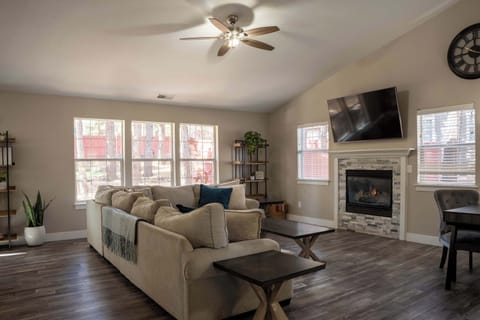 The open-concept living and dining area flows effortlessly, creating a calm and inviting space to relax, gather, and enjoy slow mornings or cozy evenings together.  Gas fireplace, large Roku t.v.
