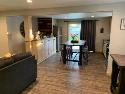 Table for 6 in the kitchen with a small table for two just off of the kitchen.