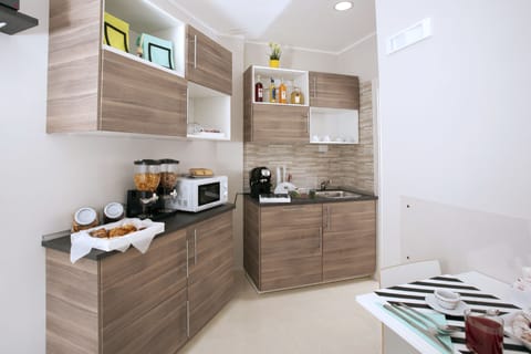 Mini-fridge, microwave, electric kettle, toaster