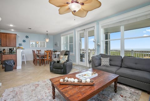 Spacious open floor plan with beautiful sunset views from living room, dining, & kitchen.