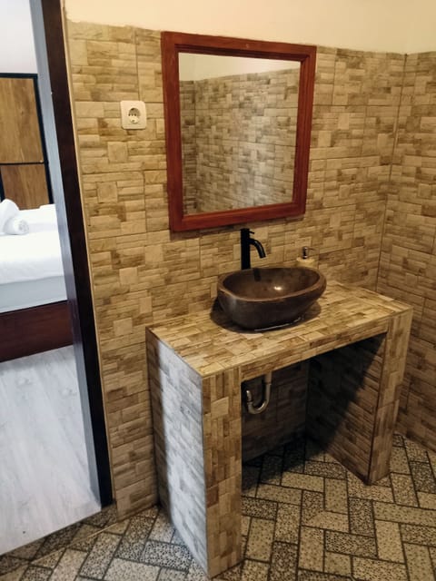 Shower, towels, soap, toilet paper