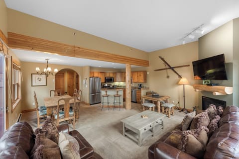 Living area with flat screen TV and gas burning fireplace