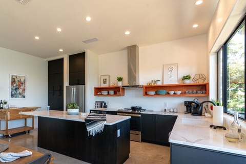 Kitchen area with stainless appliances.