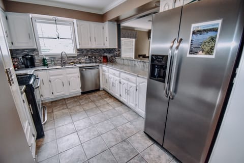 Fully equipped kitchen with opening into living room. (Open room concept)