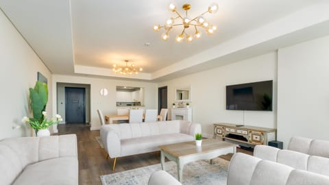 Luxury Apartment, 2 Bedrooms, Sea View (Palm View) | Living area | 55-inch Smart TV with cable channels