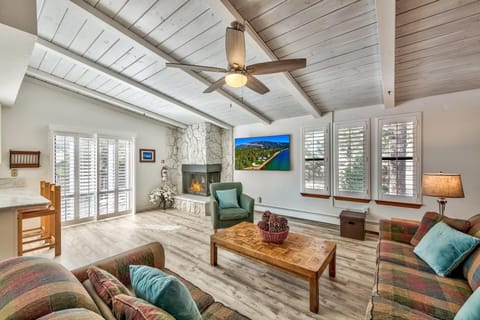 Bright, spacious living area, recently remodeled, with wooden floors & shutters