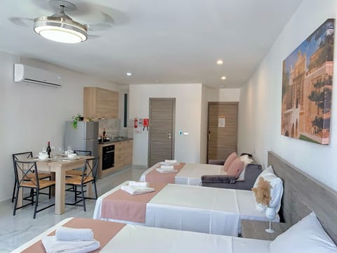 Superior Studio Suite | Living area | 32-inch LCD TV with satellite channels, TV