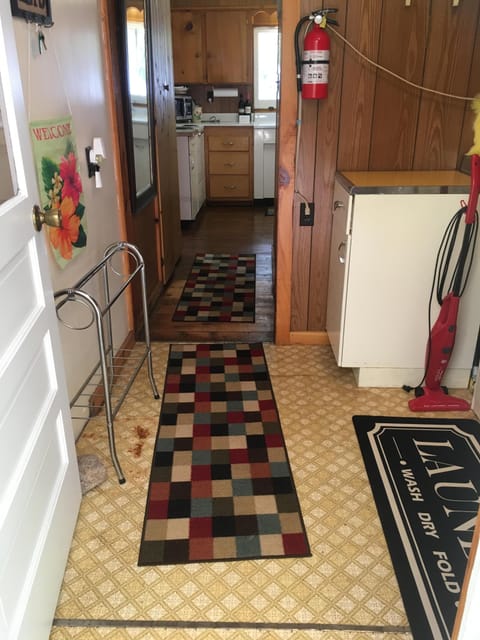 Laundry room with full-sized washer and dryer.