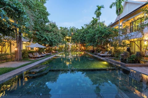 Outdoor pool, open 7:00 AM to 10:00 PM, free cabanas, pool umbrellas