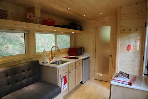 The frost bathroom door allows light while maintaining privacy.