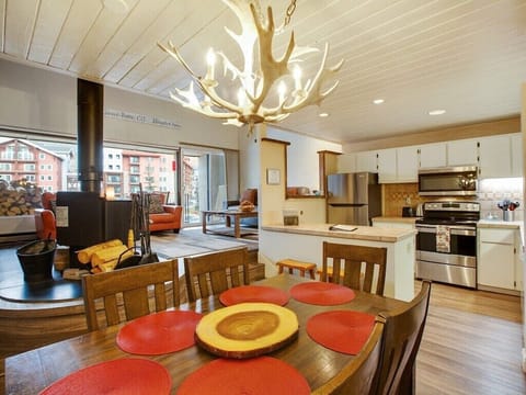 Dining room with open kitchen and living room