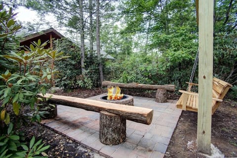 Outdoor fire pit with swing.