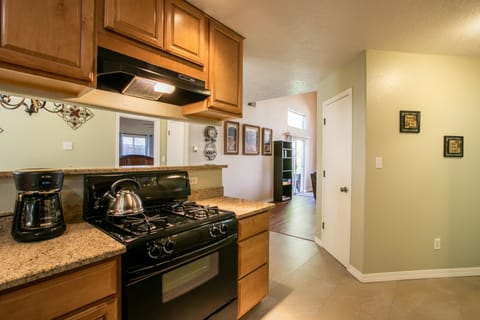 Granite counters/maple cabinets. Drip coffee maker and NM Pinion coffee provided