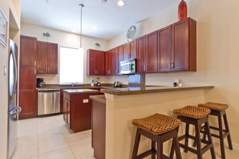 Our kitchen boasts full size appliances, center island, and breakfast bar for 3.
