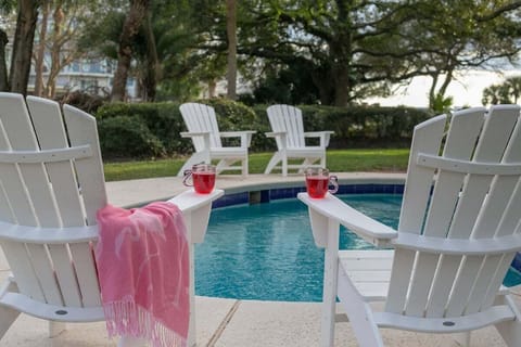 Close-up of pool area with lounge chairs