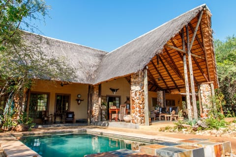 Outdoor pool, open 6:00 AM to 6:00 PM, pool umbrellas, sun loungers