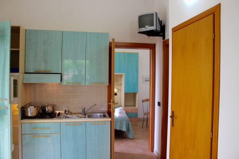 Apartment, 1 Bedroom | Private kitchen | Full-size fridge, stovetop, coffee/tea maker, cookware/dishes/utensils