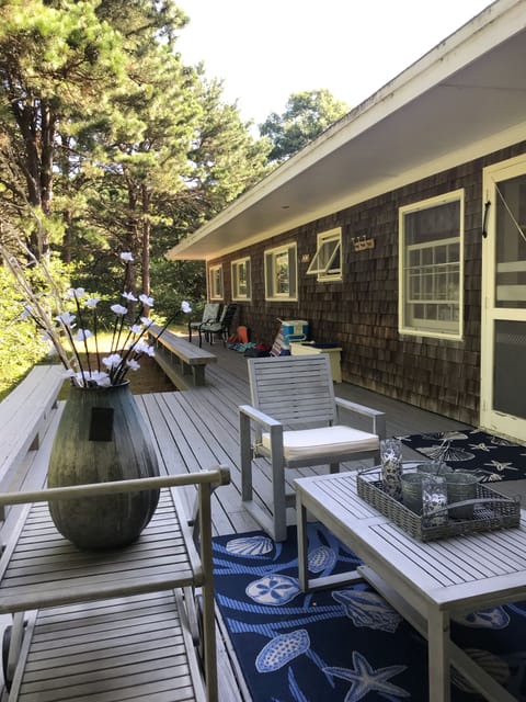 Relax on back porch...
Beach chairs and umbrellas are all there! And sand toys! 