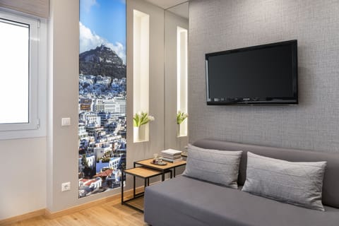 Luxury Suite | Living area | Flat-screen TV