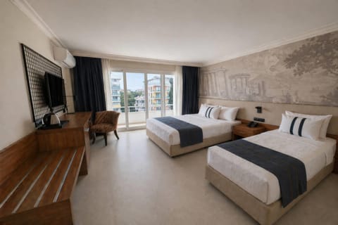 Standard Room, Multiple Beds, Sea View | Minibar, soundproofing, WiFi (free), bed sheets