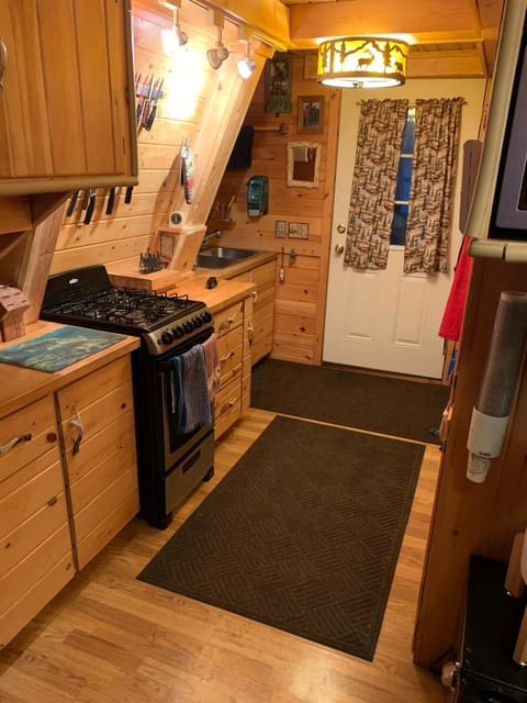 Kitchen with 2020 Commercial Gas Range Porcelain with sealed burners.