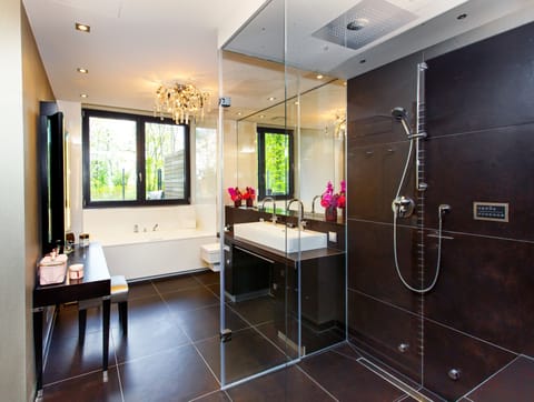 Grand Suite | Bathroom | Designer toiletries, hair dryer, bathrobes, slippers
