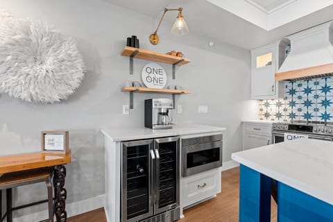 Coffee bar comes stocked with Keurig pods and has a wine fridge for storage!