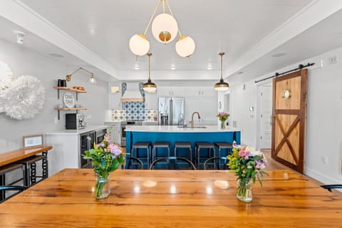 Fully equipped kitchen includes coffee station and counter top seating.  