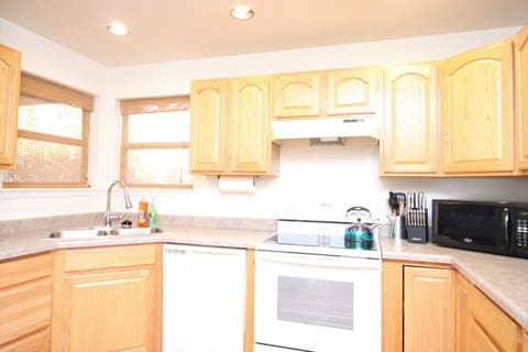 Kitchen has a toaster, blender, crock-pot, microwave and a drip coffee maker