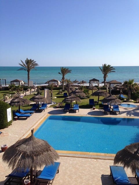 Outdoor pool, open 8 AM to 7 PM, pool umbrellas, sun loungers