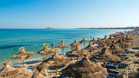 Private beach, white sand, sun loungers, beach umbrellas