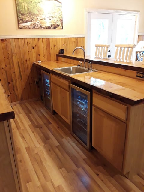 wet bar in game room 1st floor with 2 bar refrigerators