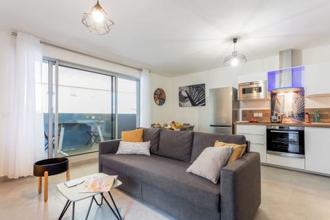 Bright living room with a double sofa bed