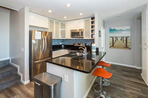 Fully stocked kitchen features all stainless steal appliances