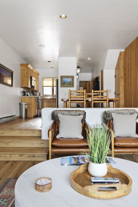 Living room opening to the dining area - The murphy bed is located in the cedar built in located in the dining room shown in this image.