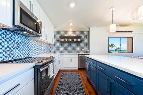 Kitchen with Italian tiles and wood open shelves, quartz countertops