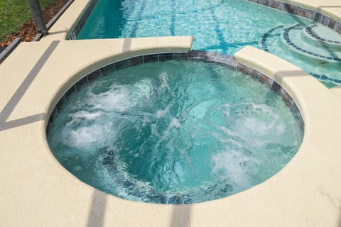 Bubbling spa with waterfall spillover. Add spa heating for  extra relaxation.