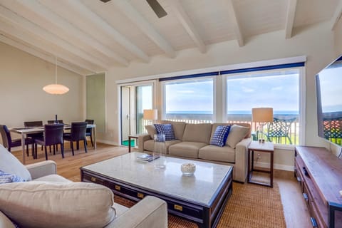 Floor-to-ceiling windows keep the ocean in view throughout the living area.