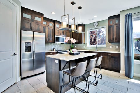 Clean and Well Equipped Kitchen with a classy Island Top Counter