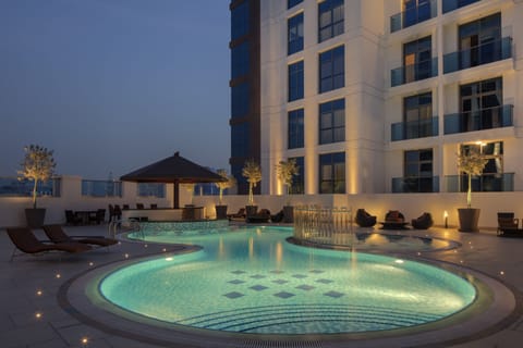 Outdoor pool, open 8:00 AM to 8:00 PM, pool umbrellas, sun loungers